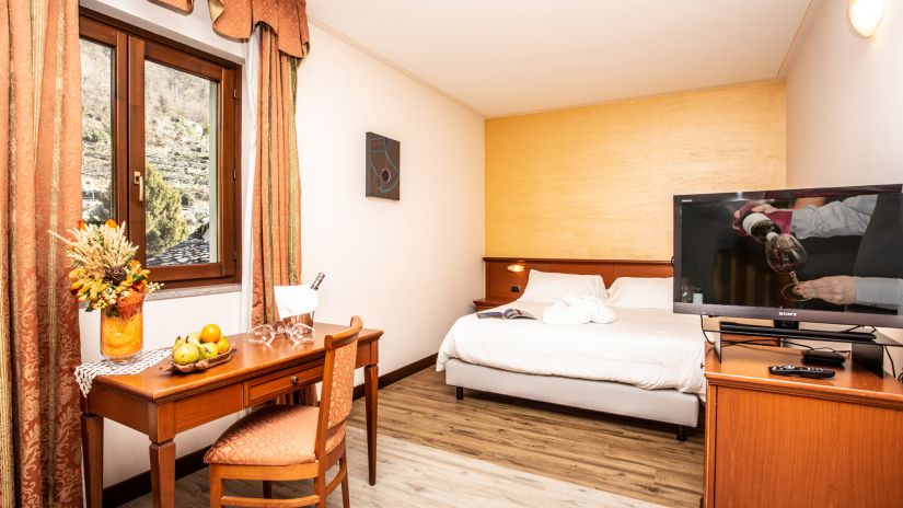 Bed, desk, and LCD TV